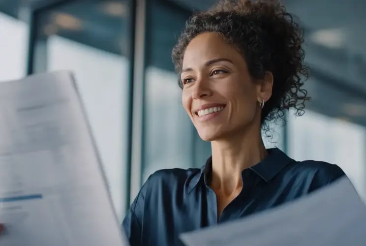 Professional woman reviewing documents in modern office setting