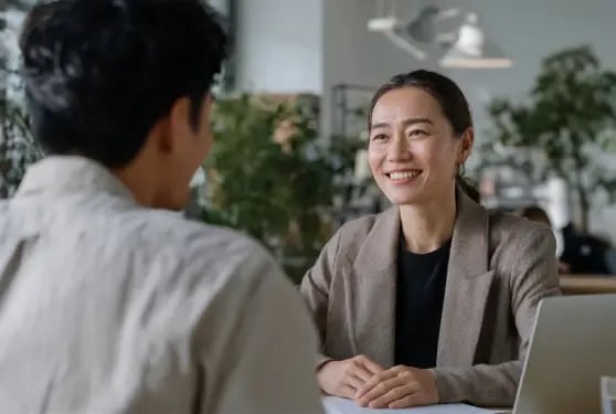 business woman smiling in a corporate consultation